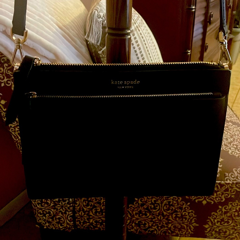 Kate Spade small black adj. crossbody  2 outer zipper and 1 slip in openings